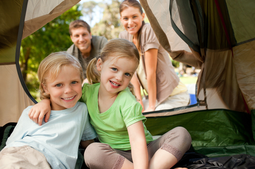 Happy family camping in the park